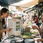Traveler communicating with a local vendor using gestures at a foreign market